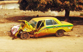 Crashed Gambian Taxi on the road to Amdallai